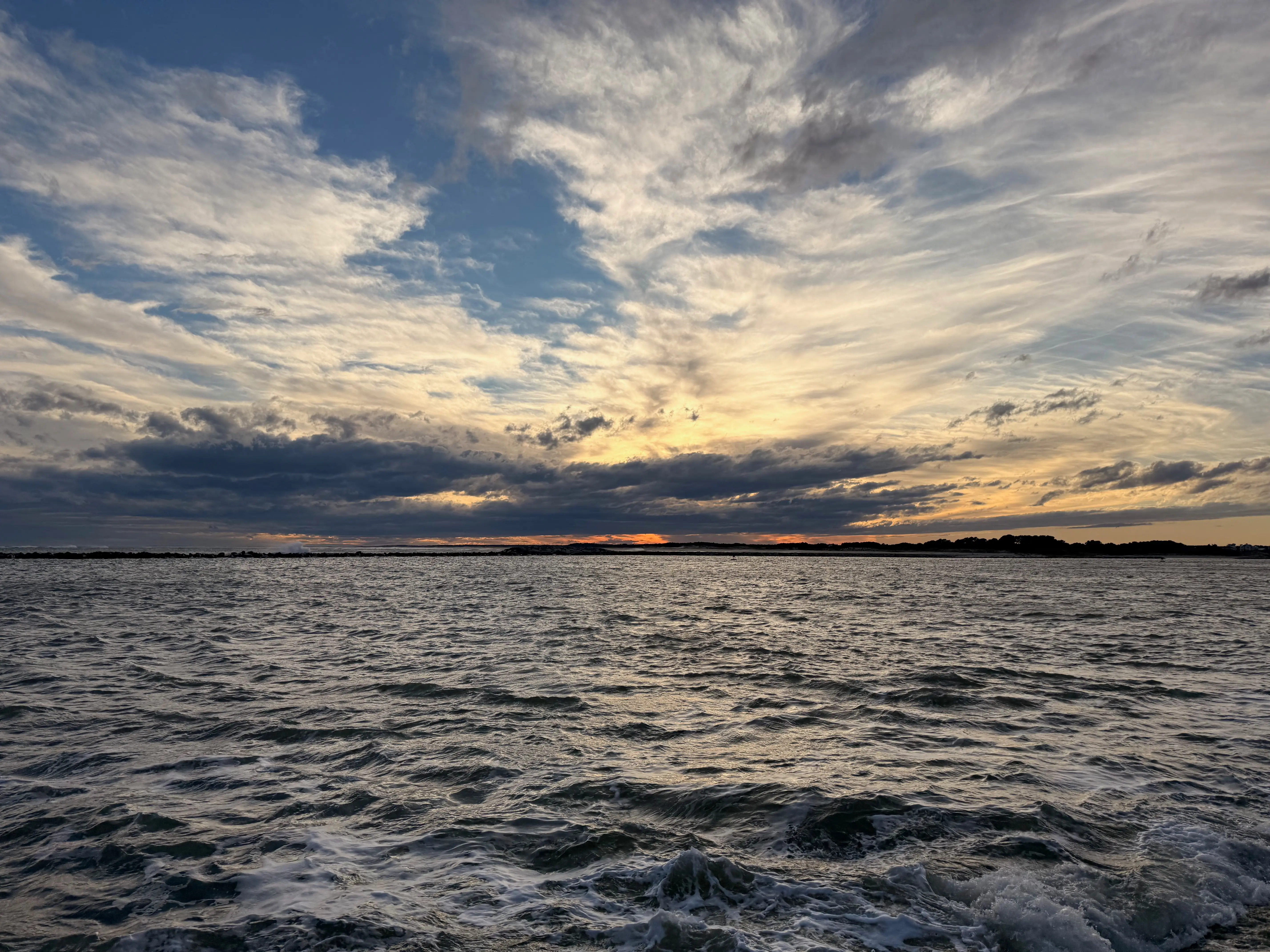 The sun setting over the water