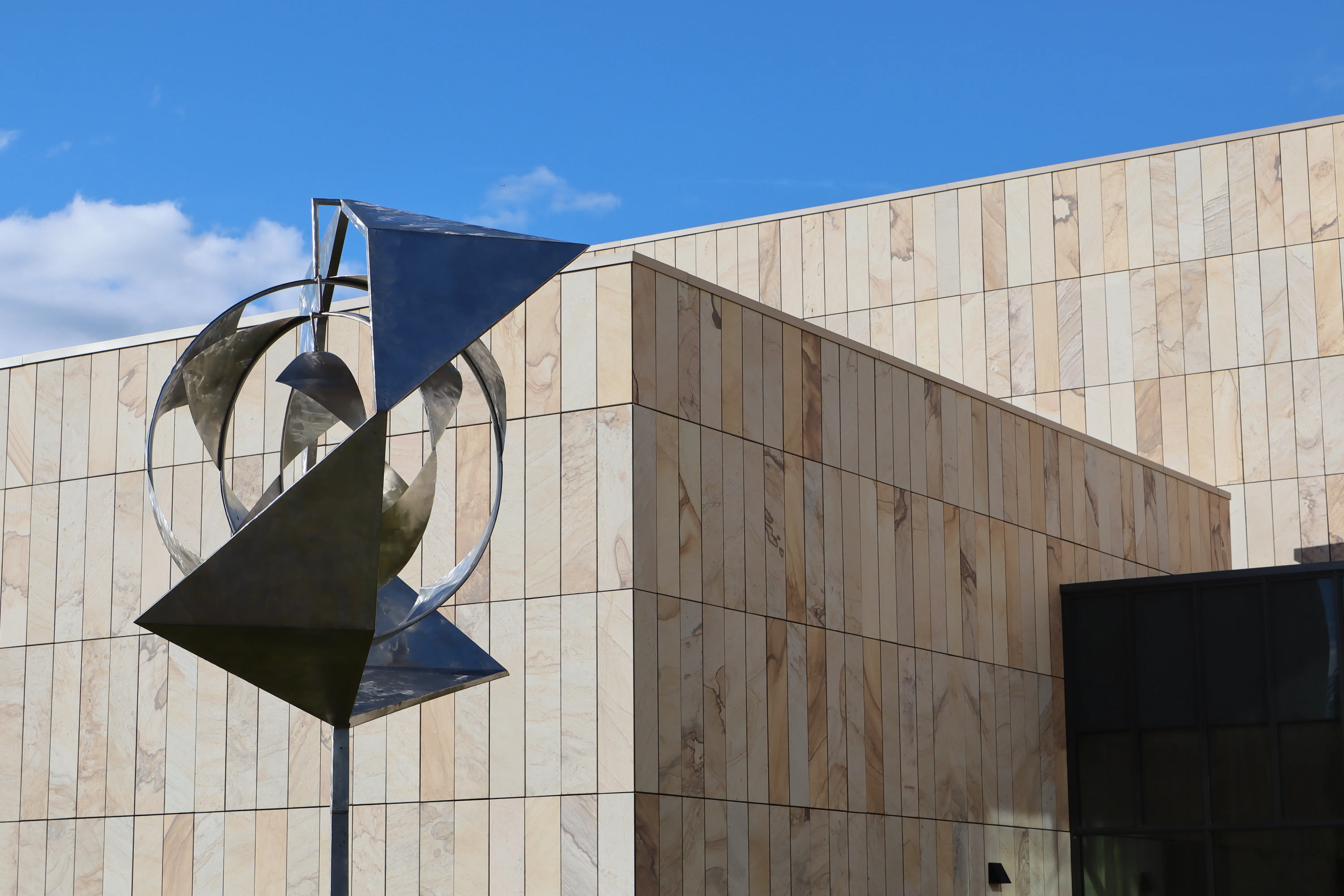 Art sculpture in front of modern building